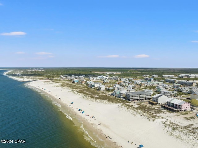 aerial view with a water view and a beach view