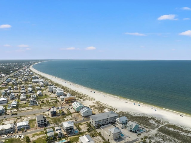 bird's eye view with a water view and a beach view