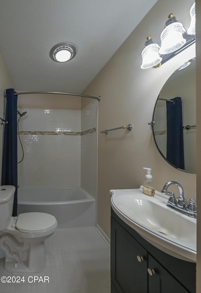 full bathroom featuring toilet, shower / tub combo with curtain, tile patterned flooring, a textured ceiling, and vanity