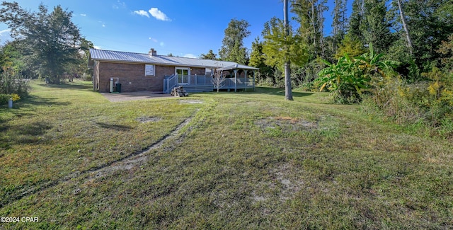 view of yard featuring a wooden deck