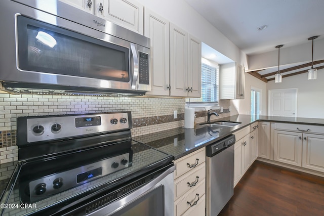4526 Brook Forest Dr, Panama City, FL 32404 - kitchen with tasteful backsplash, stainless steel appliances, beamed ceiling, a sink, and dark wood-type flooring