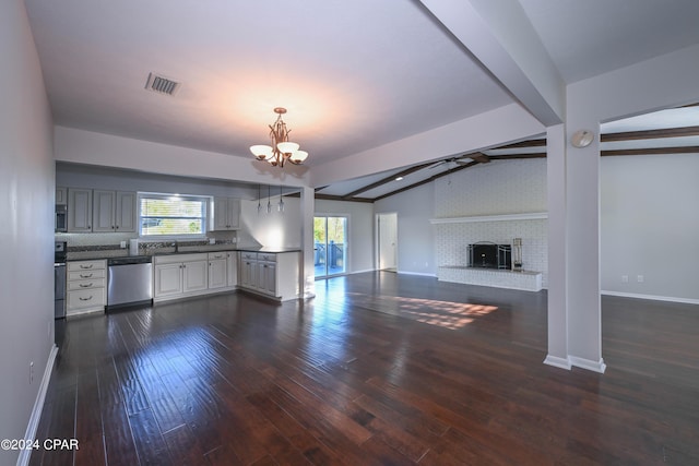 unfurnished living room featuring lofted ceiling with beams, dark wood finished floors, visible vents, and baseboards