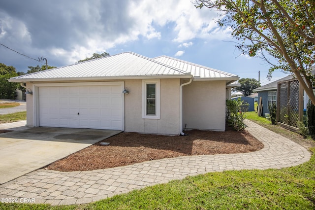 view of side of home with a garage