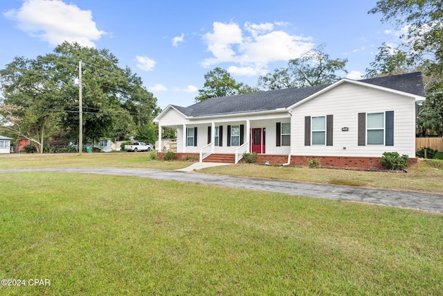 single story home with covered porch and a front lawn