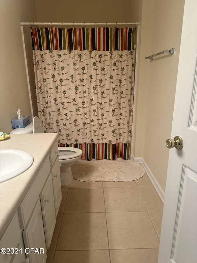 full bathroom featuring tile patterned flooring, vanity, toilet, and shower / bath combo with shower curtain