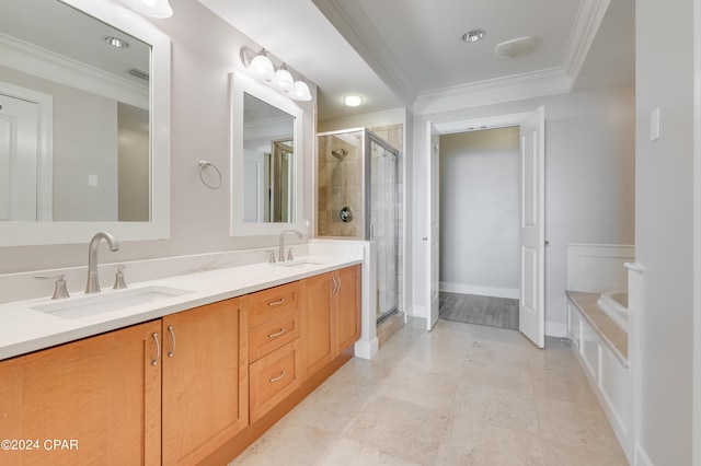 bathroom with vanity, crown molding, and separate shower and tub