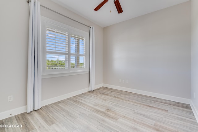 unfurnished room featuring ceiling fan and light wood-type flooring