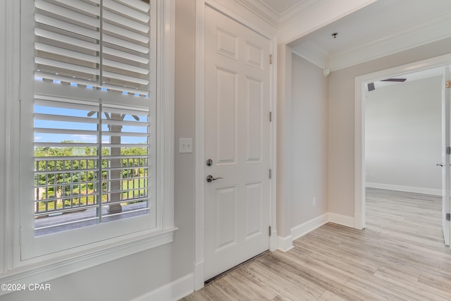 3001 W 10th St Unit 405, Panama City, FL 32401 - entrance foyer with crown molding, baseboards, and light wood-style floors