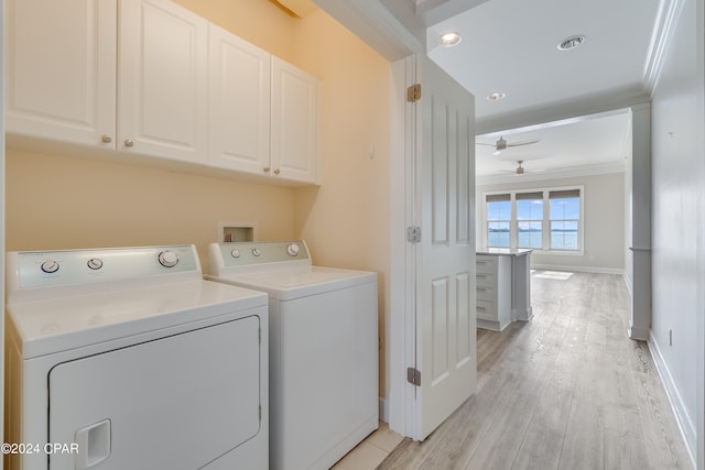 laundry area featuring cabinets, ceiling fan, separate washer and dryer, light hardwood / wood-style floors, and crown molding