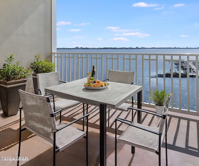 3001 W 10th St Unit 405, Panama City, FL 32401 - balcony featuring a water view and outdoor dining area