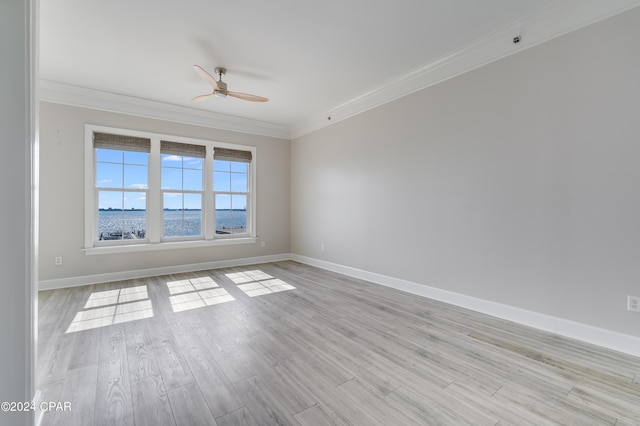 3001 W 10th St Unit 405, Panama City, FL 32401 - empty room with crown molding, a ceiling fan, baseboards, and light wood-style flooring