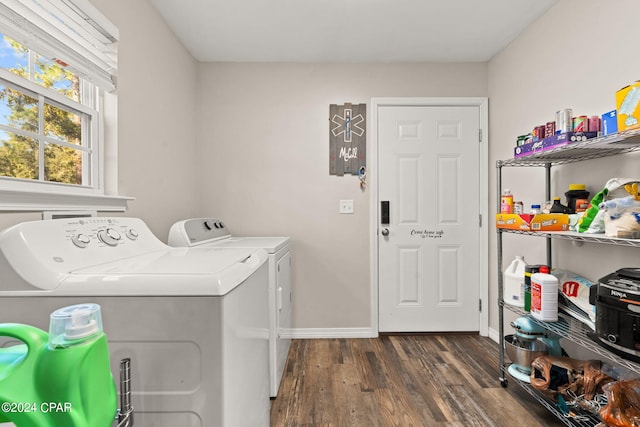 clothes washing area featuring dark hardwood / wood-style floors and washing machine and dryer