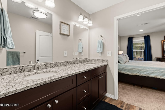 bathroom with vanity and hardwood / wood-style flooring