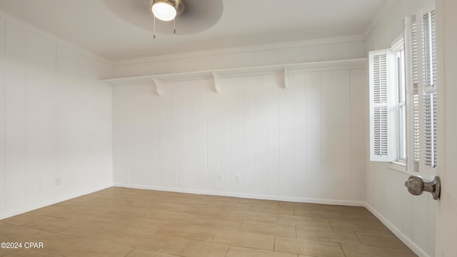 walk in closet with ceiling fan and light wood-type flooring