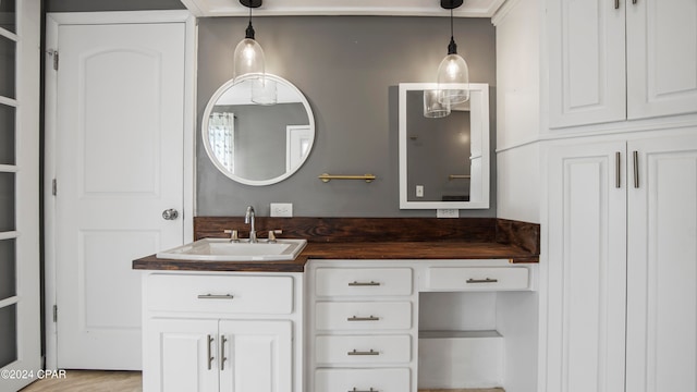 bathroom featuring hardwood / wood-style floors and vanity