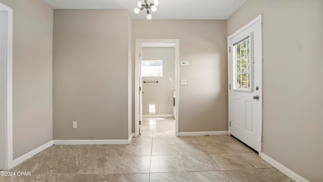 foyer featuring a notable chandelier