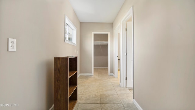 hallway featuring light tile patterned flooring