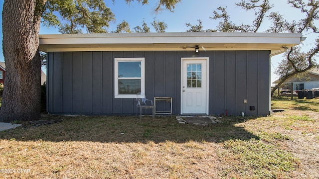 view of outbuilding with a lawn