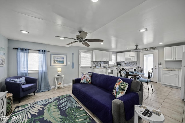 202 3rd St, Mexico Beach, FL 32456 - living area featuring light tile patterned floors, recessed lighting, baseboards, and ceiling fan