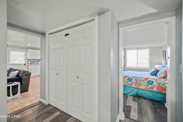 hall with dark hardwood / wood-style floors