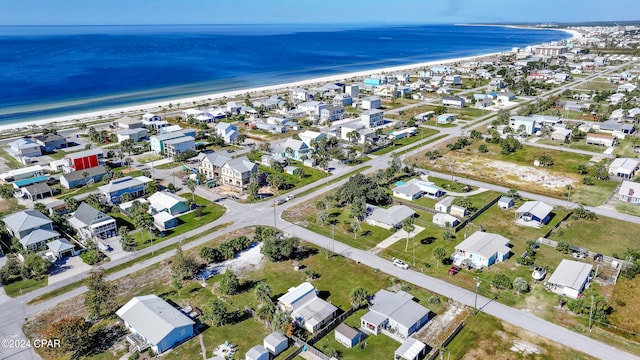 aerial view with a water view and a view of the beach