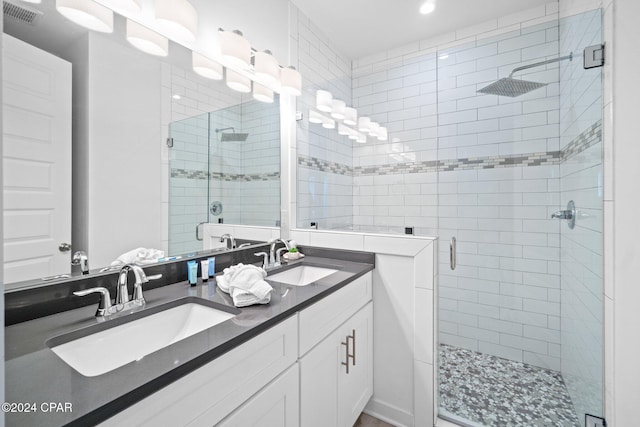 bathroom with vanity and an enclosed shower