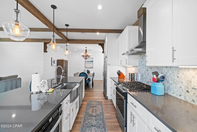 kitchen with wall chimney exhaust hood, stainless steel appliances, beamed ceiling, dark hardwood / wood-style floors, and pendant lighting