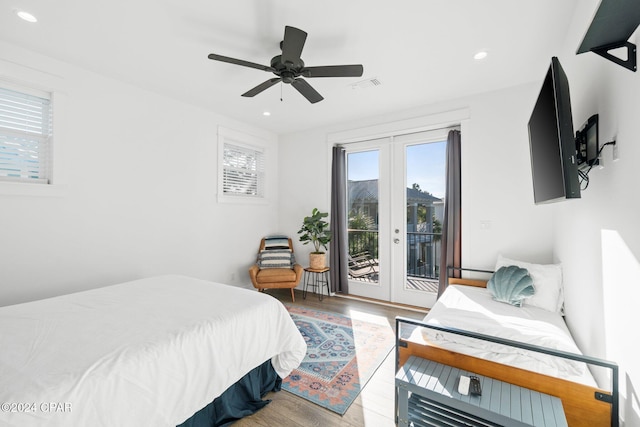 bedroom featuring hardwood / wood-style floors, ceiling fan, access to exterior, and french doors