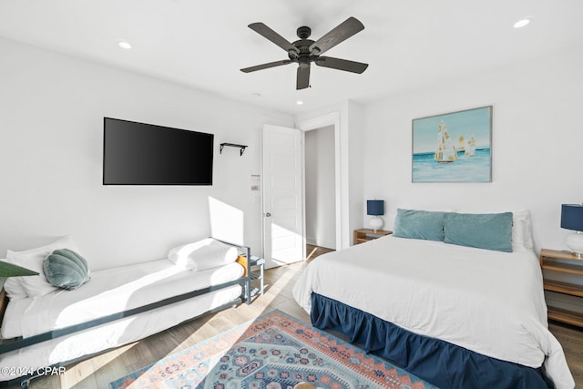 bedroom with ceiling fan and wood-type flooring