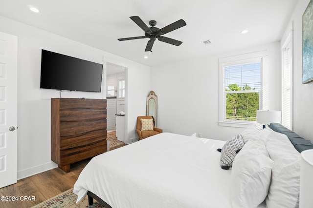 bedroom featuring dark hardwood / wood-style flooring and ceiling fan