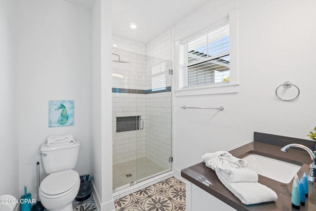 bathroom with tile patterned floors, toilet, a shower with door, and sink