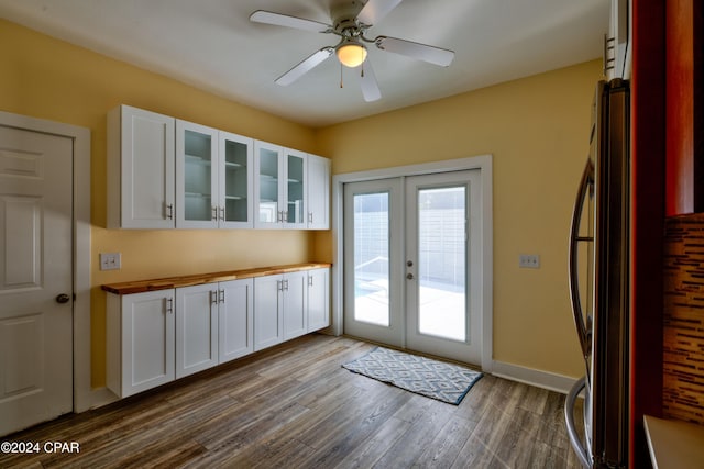 entryway featuring french doors, ceiling fan, and dark wood-type flooring