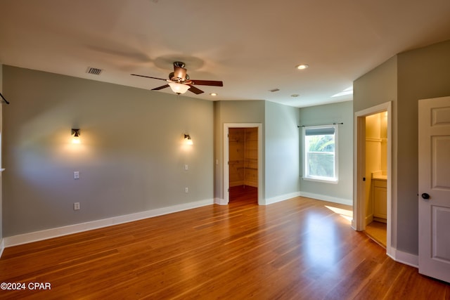 unfurnished room featuring wood-type flooring and ceiling fan