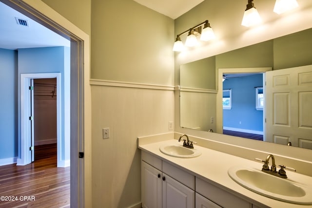 bathroom with vanity, ceiling fan, and hardwood / wood-style flooring