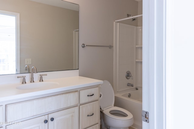 full bathroom featuring bathtub / shower combination, vanity, and toilet