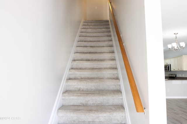 staircase with wood-type flooring