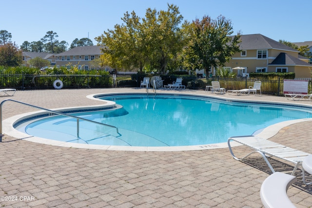 view of swimming pool with a patio