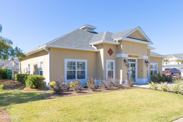 view of front of home with a front yard