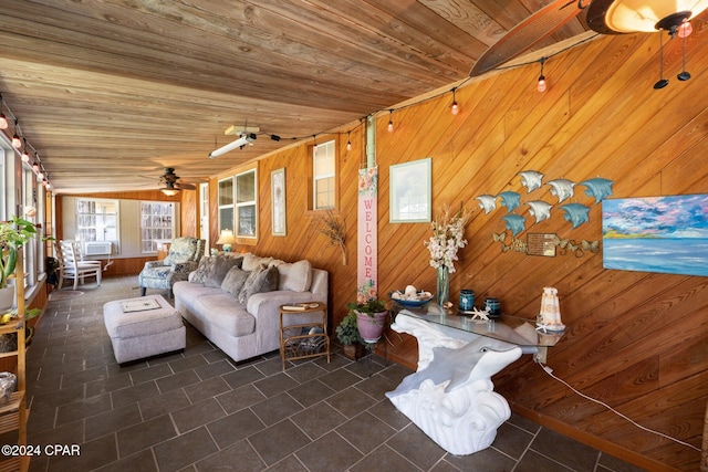 living room with cooling unit, wood walls, vaulted ceiling, wooden ceiling, and ceiling fan