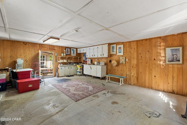 interior space featuring a workshop area and wooden walls