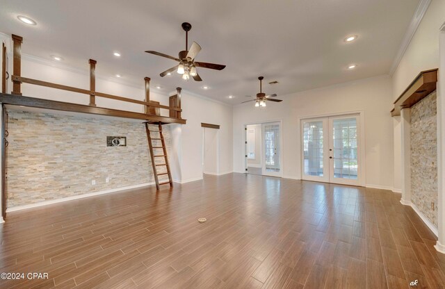 unfurnished living room with french doors, ceiling fan, hardwood / wood-style flooring, and crown molding