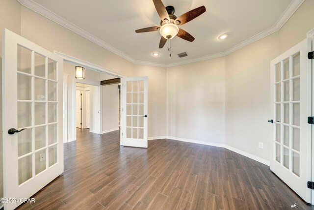 empty room with french doors, ornamental molding, ceiling fan, and dark hardwood / wood-style flooring