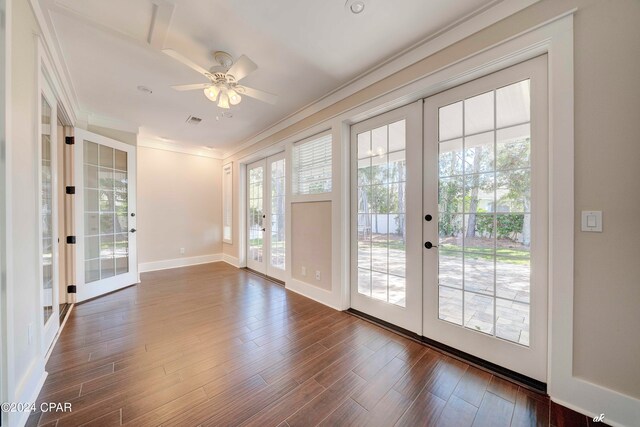 entryway with a wealth of natural light, french doors, dark hardwood / wood-style floors, and ceiling fan