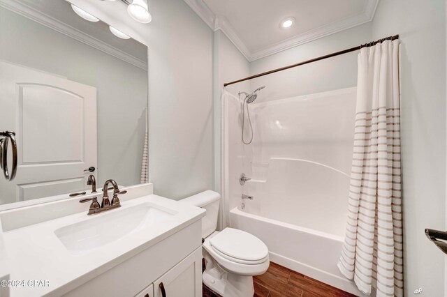 full bathroom featuring wood-type flooring, shower / tub combo, toilet, vanity, and ornamental molding