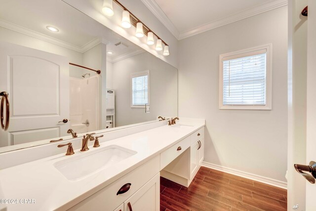 bathroom with vanity, wood-type flooring, plenty of natural light, and tub / shower combination