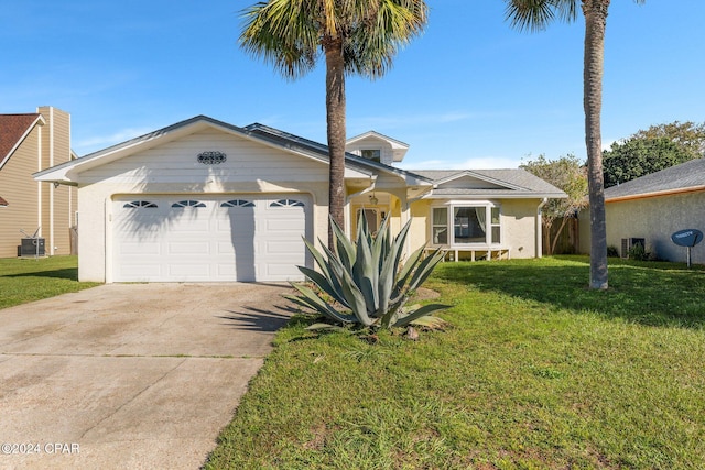 ranch-style house featuring a front yard, central AC, and a garage