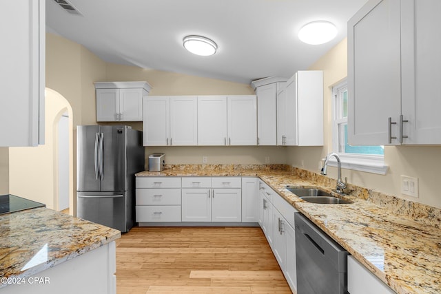 kitchen featuring white cabinetry, stainless steel appliances, sink, and light wood-type flooring