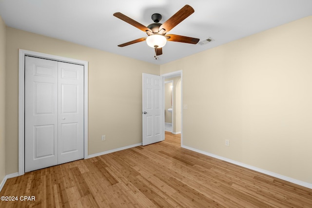 unfurnished bedroom featuring a closet, ceiling fan, and light hardwood / wood-style flooring