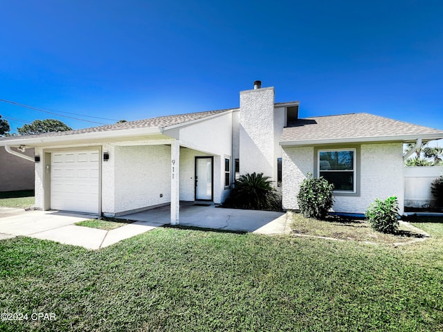 ranch-style home with a front yard and a garage