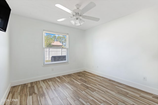 spare room with ceiling fan and light hardwood / wood-style flooring